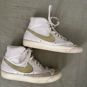 Nike White High-Top Sneakers with Pale Yellow Swoosh